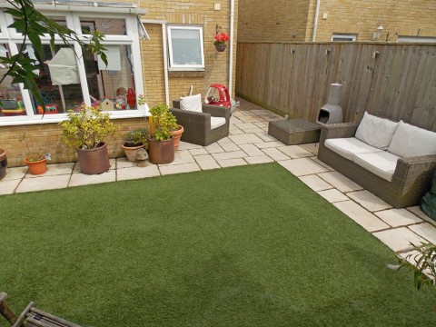 Landscaped garden with artificial grass in New Milton